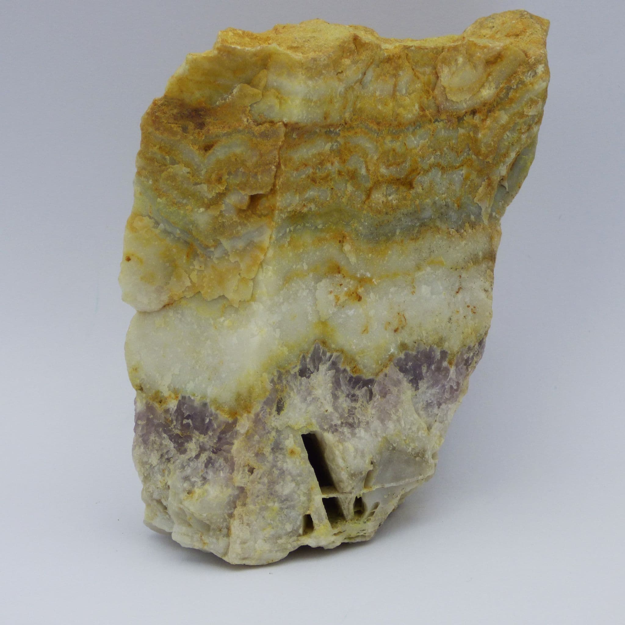 Section of Cornish quartz with vein of amethyst running through horizontally.